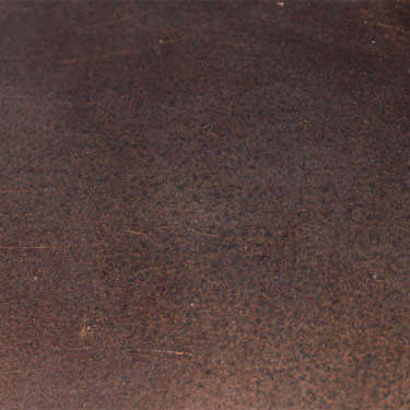 Dark Iron cast iron sheet with patina and rust. The texture of the copper  and bronze metal background . Metallic texture. Stock Photo